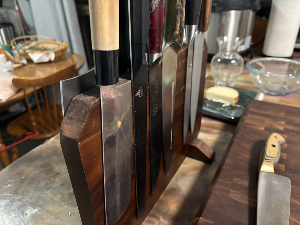 an image of kitchen knives. What is the best steel for kitchen knives?